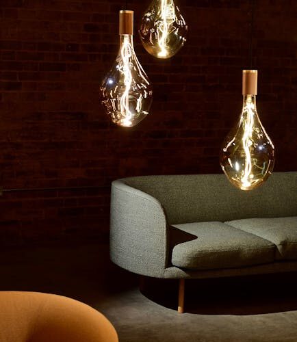 Elegant modern living room with designer lighting and minimalistic furniture.